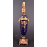 A late 19th/ early 20th century Sevres style ormolu mounted lamp with enamel and gilt decoration and
