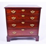 A small Georgian mahogany chest of four graduated drawers with brass handles and escutcheons, on