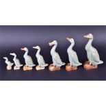 A graduated group of seven of Chinese celadon ducks some with impressed seal mark to base, the