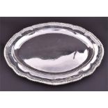 A George III silver meat dish by Paul Storr London 1807, of oval form with gadrooned rim, coat of