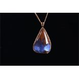 A yellow gold and boulder opal pendant the triangular cabochon boulder opal showing deep and light