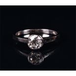 An 18ct white gold and solitaire diamond ring the bezel-set diamond of approximately 0.70 carats,