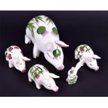 A group of five Plictha pig figures to include a large example decorated with thistles, (24 cm