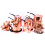 A good quantity of 19th century and later copper kitchenware to include covered pans, moulds,