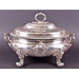 A George III silver soup tureen by William Burwash, London 1816, of twin-handled oval form, the