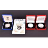 Three Peter Rabbit commemorative silver coins two boxes, one in a slip case, a silver five pound