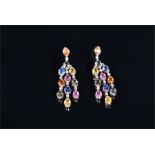 A pair of white gold, diamond and multi-coloured sapphire drop earrings each set with oval cut