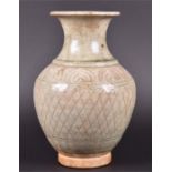 An 18th century Chinese celadon glazed vase  of flared-rim baluster form, the body with incised