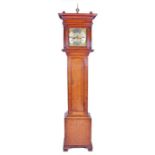 A 19th century oak eight-day longcase clock by Jonathan Simpson the everted stepped hood flanked