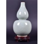 A 20th century Chinese celadon porcelain double-gourd vase with crackled finish to glaze, with