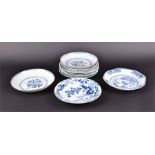 Five late 19th century/ early 20th century Chinese blue and white plates of floral design together