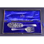 A pair of Mappin & Webb pierced silver plated fish servers with engraved and bright cut