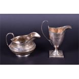 A George III silver cream jug of helmet form London 1815, indistinct maker's mark, with loop