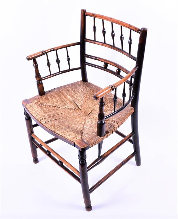 A Victorian oak and stained beech William Morris Sussex chair with rush seat and turned supports, - Image 2 of 5