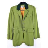 A pea green Hermes jacket with dark velvet collar  and yellow and red lining, size 40, together with