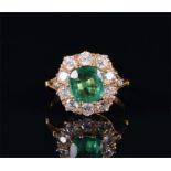 An 18ct yellow gold, diamond, and emerald ring set with a cushion-cut emerald of approximately 2.0