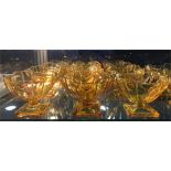 A set of twelve Sowerby 1920s-30s Art Deco yellow pressed glass dessert dishes pattern 2631, the