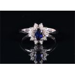 An 18ct white gold, diamond, and sapphire oval cluster ring size P, 2.9 grams.