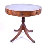 A mahogany drum table with green gilt-tooled leather scriber, three drawers and three dummy drawers,