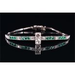 An early to mid 20th century white metal, diamond, and emerald bracelet in the Art Deco style,