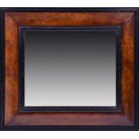 A 17th century style cushioned walnut wall mirror  57cm high x 65cm wide. CONDITION REPORT Condition