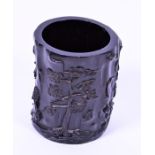 A Chinese hardwood brush pot of cylindrical form with relief-carved decoration depicting trees,