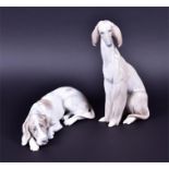 Two large Lladro models of dogs to include a seated afghan hound, 29 cm high and a large seated