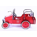 A child's vintage pedal car toy in the form of a 1938 fire engine with red painted finish, 'FD'