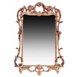 A large 19th century gilt gesso wall mirror  of rectangular form with profuse leaf and scroll border
