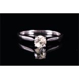 An 18ct white gold and solitaire diamond ring set with a round brilliant-cut diamond of