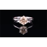An 18ct white gold and solitaire diamond ring set with a round brilliant-cut diamond of