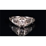 An 18ct white gold and diamond Art Deco ring the engraved mount set with a round brilliant-cut