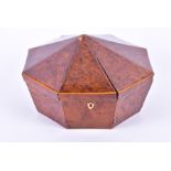 A George III birds eye walnut octagonal sewing box with boxwood stringing and paper-lined