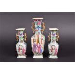 A garniture of 3 late 18th/ early 19th century Chinese Jiaqing period famille rose vases twin
