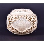 A  Japanese meiji period ivory reticulated box and cover the body formed of four reserves united