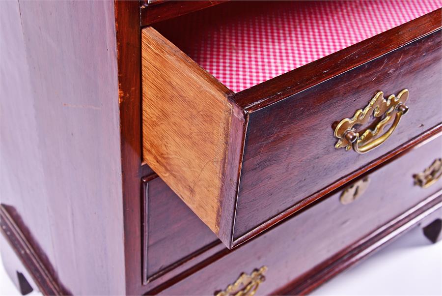 A small Georgian mahogany chest of four graduated drawers with brass handles and escutcheons, on - Image 4 of 4