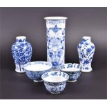 An assortment of 6 Chinese Qing period blue and white ceramics to include a 19th century spill