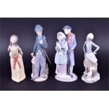 A selection of Lladro figure groups to include a figure of Charlie Chaplain, 29 cm high, '