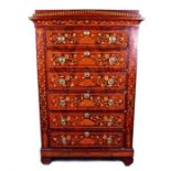An early 19th century Dutch marquetry chest the small arch pediment over six drawers, the inlaid