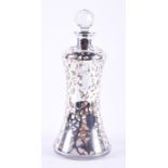 A glass decanter with silver overlay in a vine pattern, marked for London, by Henry Perkins & Sons.