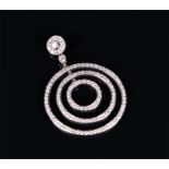 A white metal and diamond set pendant comprising of three concentric circles pavé set with round cut