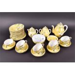 An extensive Japanese eggshell tea service decorated with cranes below bamboo, on a yellow ground to