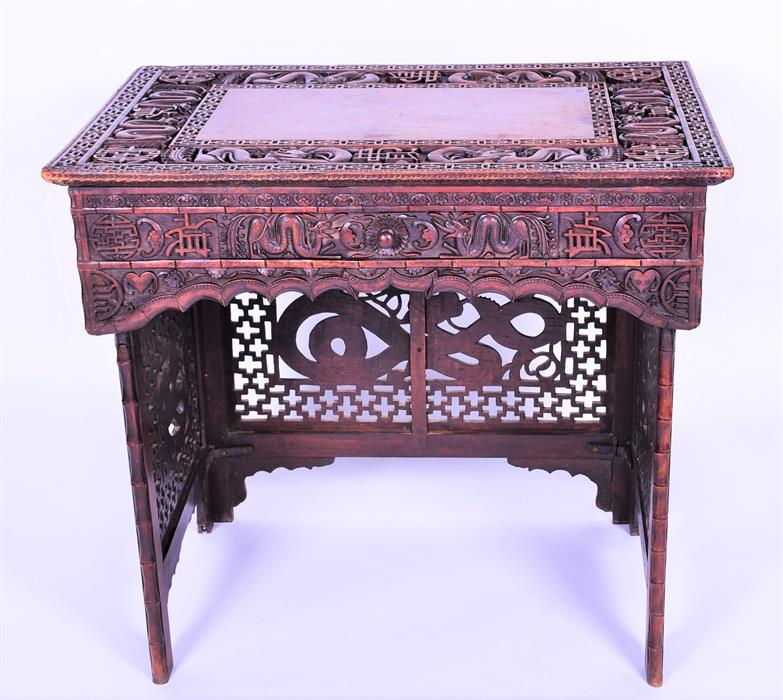 A late 19th / early 20th century Chinese hardwood writing table the rectangular top inlaid with