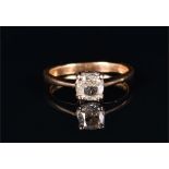 An 18ct yellow gold and solitaire diamond ring set with a cushion-cut diamond of approximately 1.0