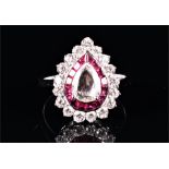 An 18ct white gold, diamond, and ruby ring set with a pear-shaped rose-cut diamond of