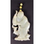 A jade carving of a Chinese sage accompanied by a peahen a piece of cork attached to a a string of