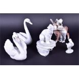 A selection of Lladro and Nao animal groups to include a Lladro 'Platero and Marcelino' group of a