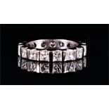 A fine diamond eternity ring bar-set with princess cut diamonds of approximately 4.0 carats