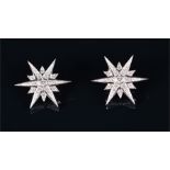 A pair of 18ct white gold and diamond star-burst earrings set with round brilliant-cut diamonds of
