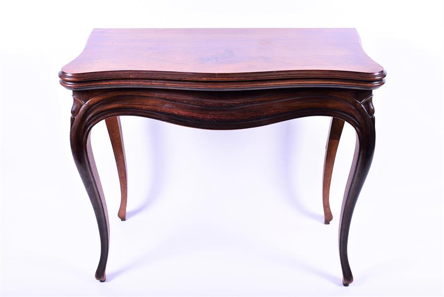 A good 19th century French card table with mahogany base and rosewood veneered top of bombe form,